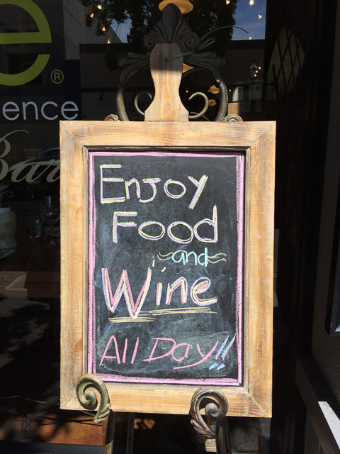 we-olive-walnut-creek-outside-enjoy-food-wine-sign