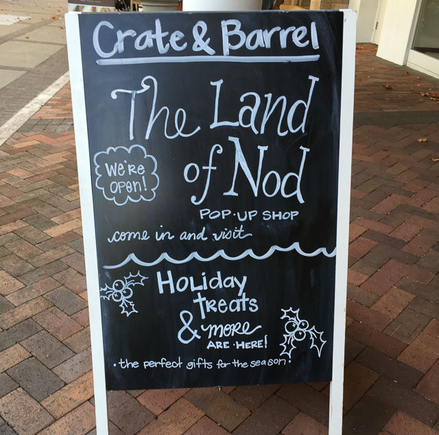 land-of-nod-crate-barrel-sign
